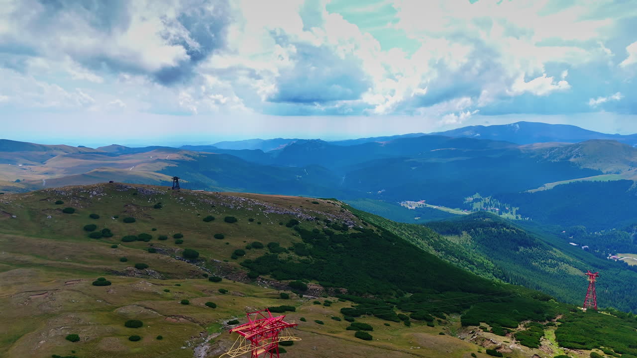 Panoramic plateau with cable installation. Cable structure stands on the plateau of Caraiman surrounded by wide alpine views