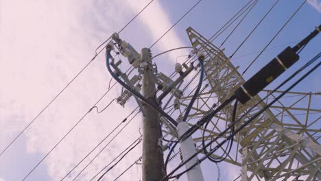 Low-angle-view-looking-up-at-power-grid-and-power-lines