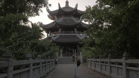 woman having touristic walk in bai dinh temple area vietnam