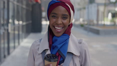 portrait young happy african american business woman laughing enjoying successful urban lifestyle beautiful black muslim female wearing traditional hijab headscarf in city