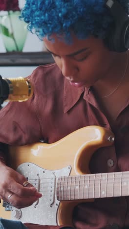 Guitar melodies and creative moments at home with a passionate musician