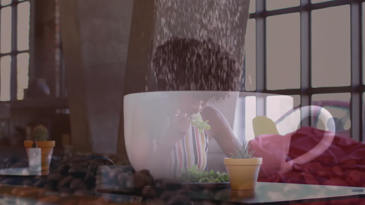 woman eating salad in café loft, showing animated coffee cup and beans for health marketing