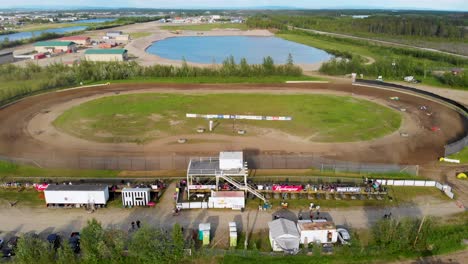 4k drone video of stock car racing at mitchell raceway in fairbanks, ak during sunny summer evening-4