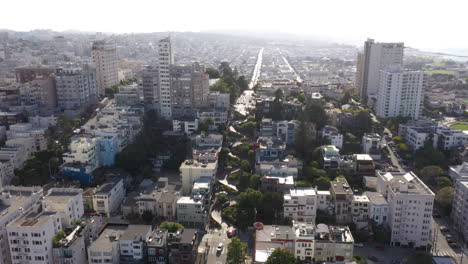 downtown with a view of the prominent winding road of lombard street in san francisco, united states. aerial drone shot