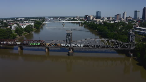 Aerial-of-freight-train-crossing-Rock-Island-Bridge-from-North-Little-Rock-to-Little-Rock