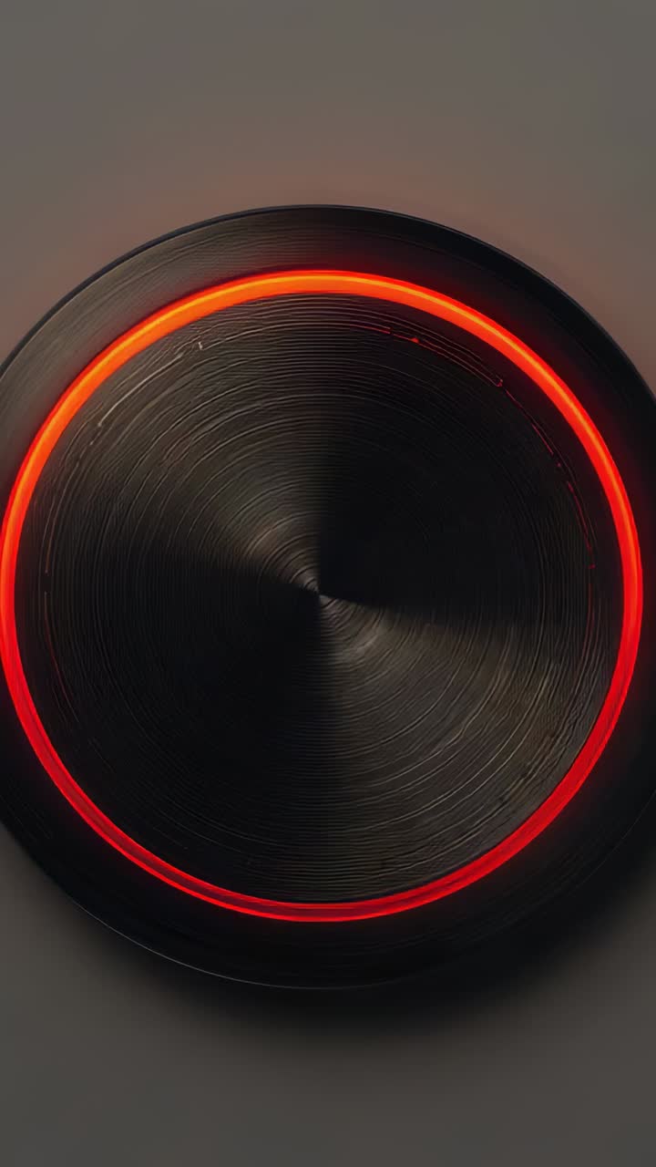 Vertical video: Animating circular metallic knob powering on, sweeping orange LED ring on panel