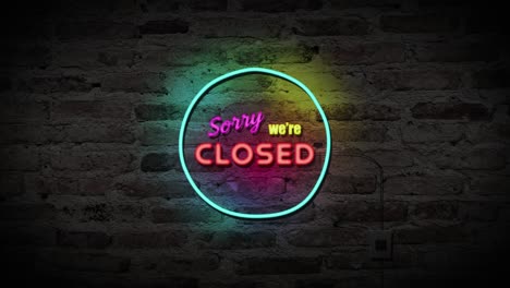 sorry we're closed neon sign on brick wall background. business and service concept.