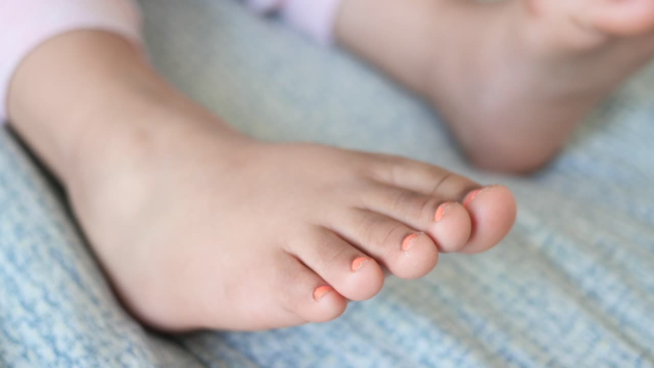 Baby Feet with Orange Nails