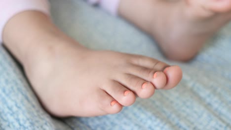baby feet with orange nails
