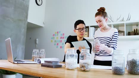 business executives using digital tablet