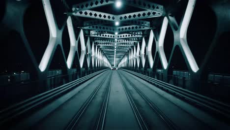 night reverse flight through a steel tram-train bridge