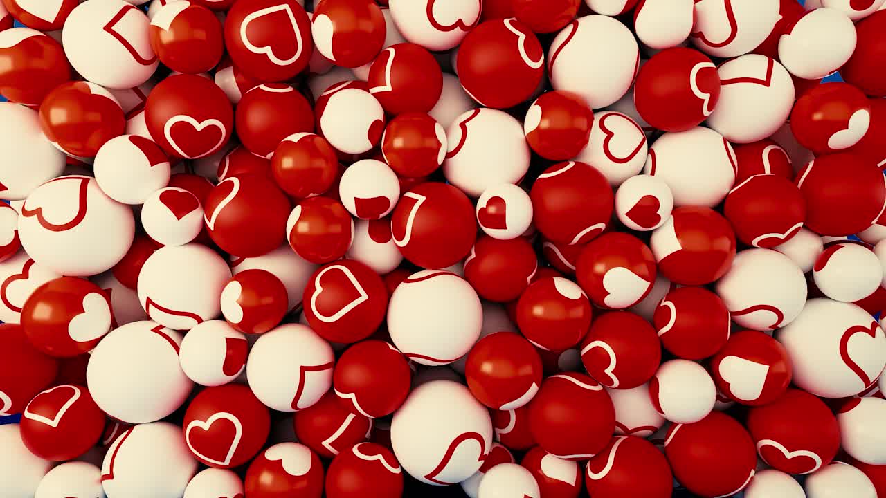 Pila di palline rosse e bianche con cuori