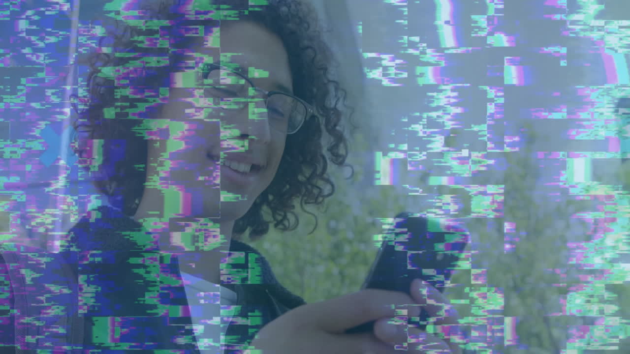 Using smartphone with colorful digital animation effects overlay, smiling person