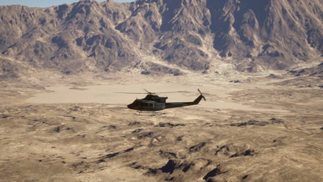 helicopter flying over desert mountains