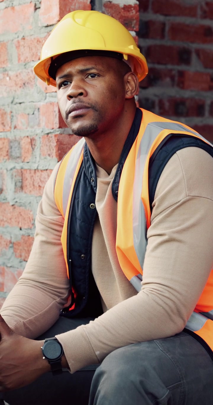 Construction Worker Eating an Apple During a Break