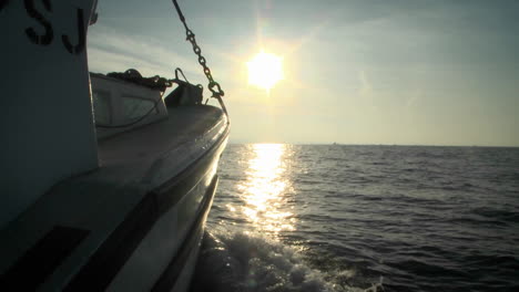 A-boat-sails-in-open-waters-towards-the-horizon