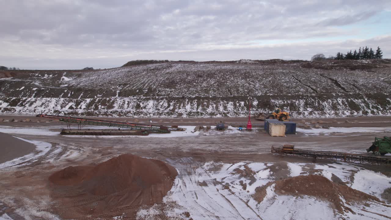 Birdseye View Of Front End Loader Driving in a Quarry - Steady Shot