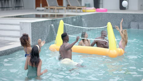 diverse group enjoys a playful game in a pool