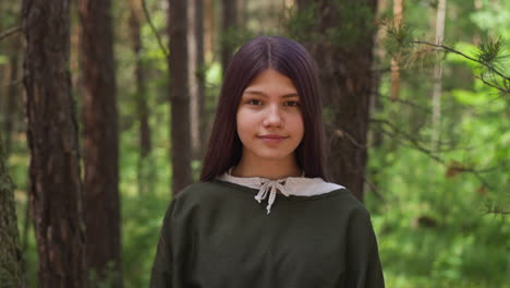 dark-haired girl in medieval dress smiles