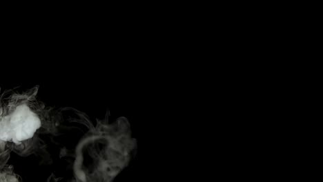 smoke rings of dry ice in motion on a black background. closeup
