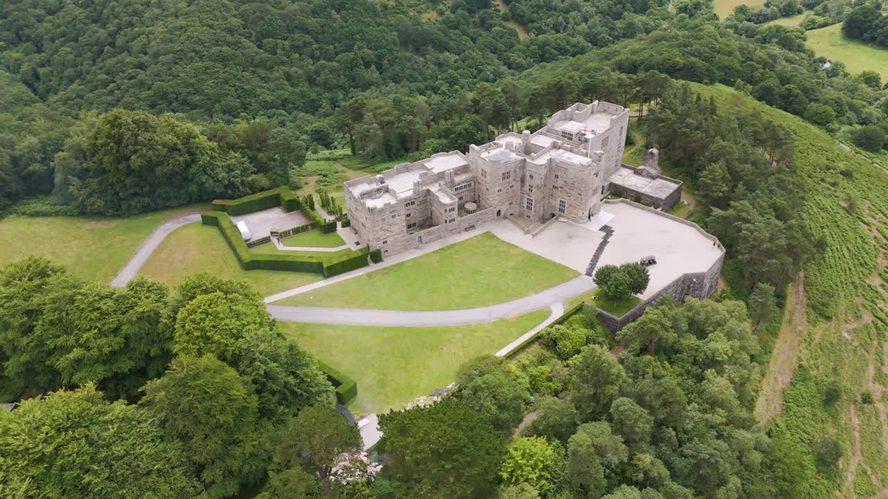 Aerial View of a Historic Stone Castle Estate in a Lush Green Forest