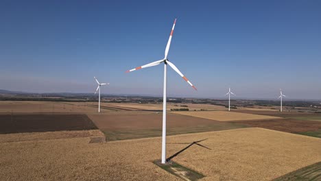 aerial view of wind turbines in a rural landscape