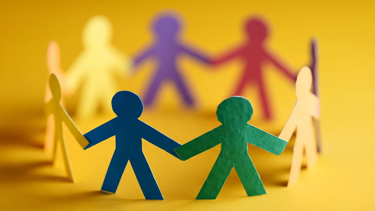 Colorful paper cutout figures in a circle