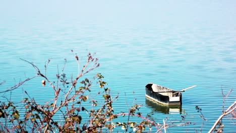 Boat-floating-in-a-lake