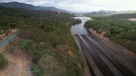 Over-the-spillway-and-road-and-looking-to-the-Goulburn-River-at-Lake-Eildon,-Victoria,-Australia
