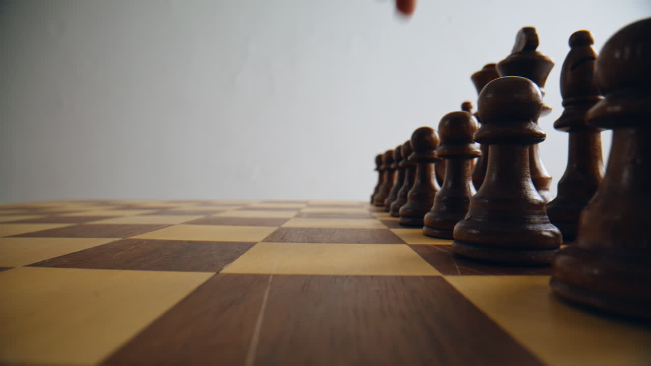 Unknown man playing chess closeup. Unrecognizable gamer engaged thoughtful game