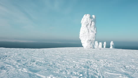 snowy mountain plateau with frozen rocks