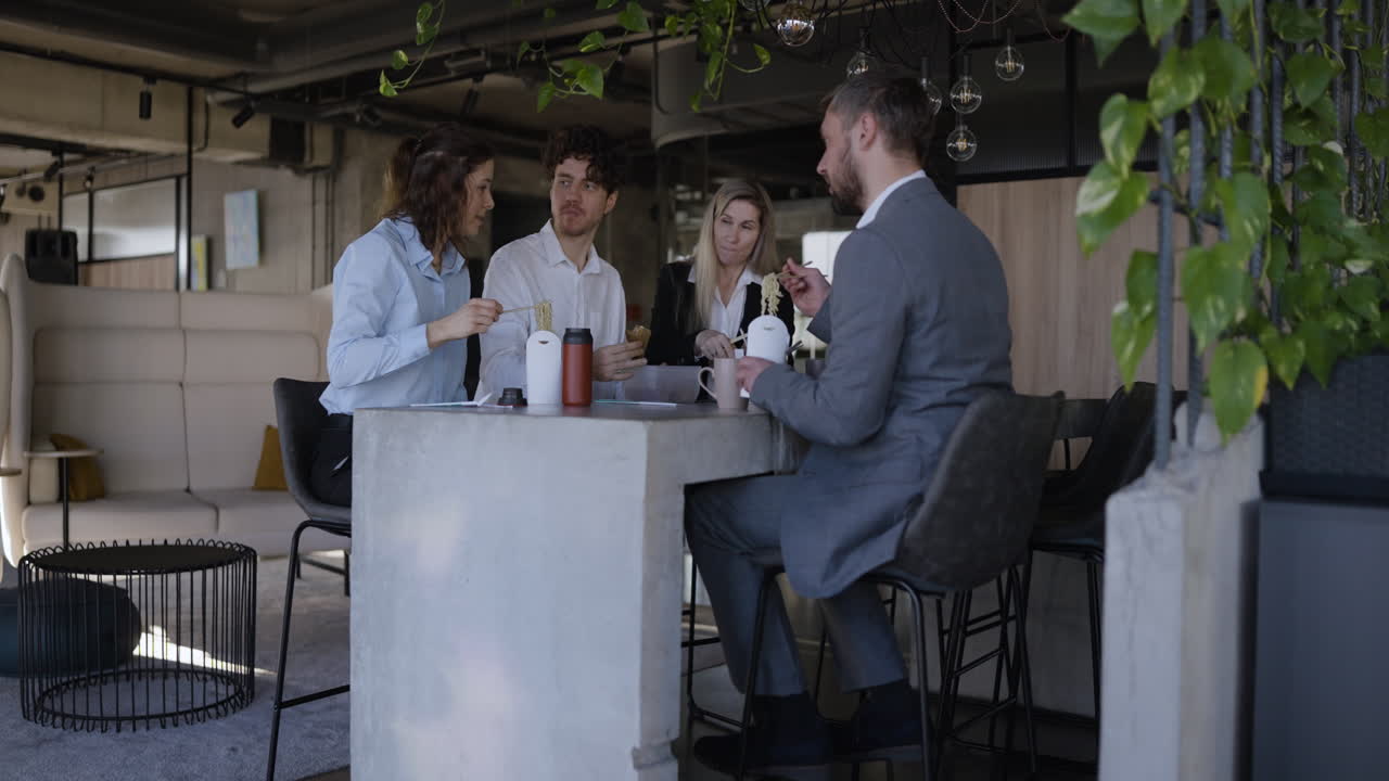 Business Team Lunch Meeting in Modern Office