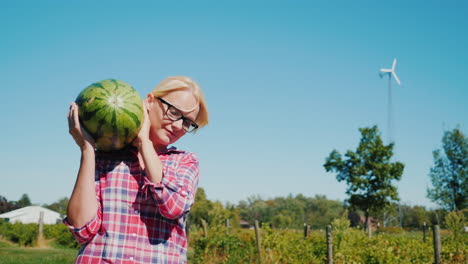 Woman-Carrying-Watermelon-on-a-Farm