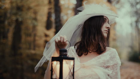 woman in white dress with lantern in a mystical forest