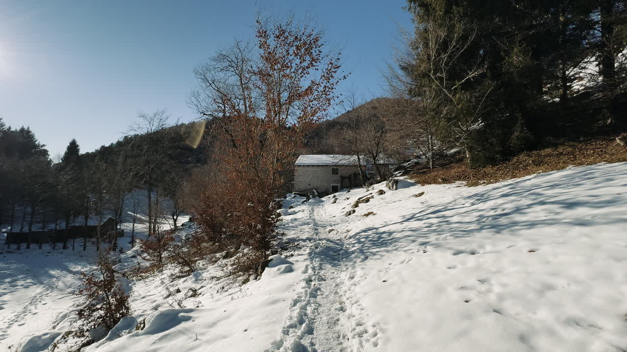 Snowy Mountain Path and Cabin