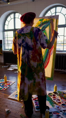 artist painting in a studio