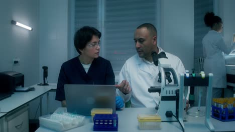 scientists discussing research in a laboratory