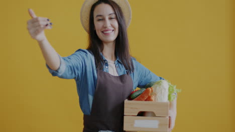 woman farmer presenting fresh produce