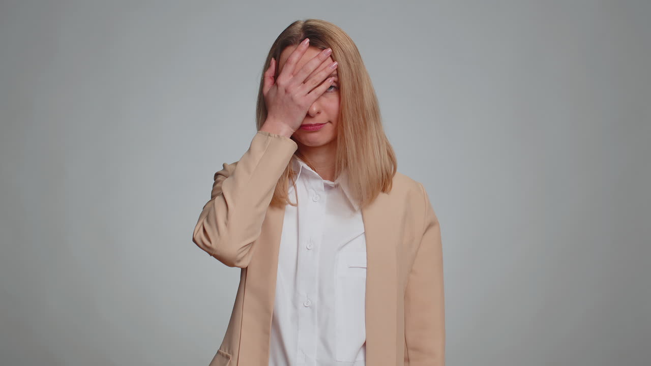 Upset businesswoman making face palm gesture feeling bored disappointed in result bad news shame
