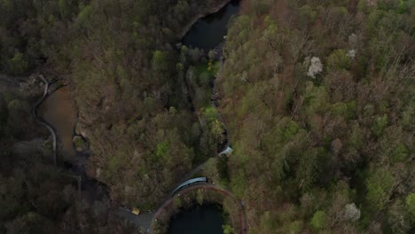 Aerial-View-Of-Bear-Lake,-Red-and-Black-Lake-By-The-Forest-Near-Sovata-In-Romania