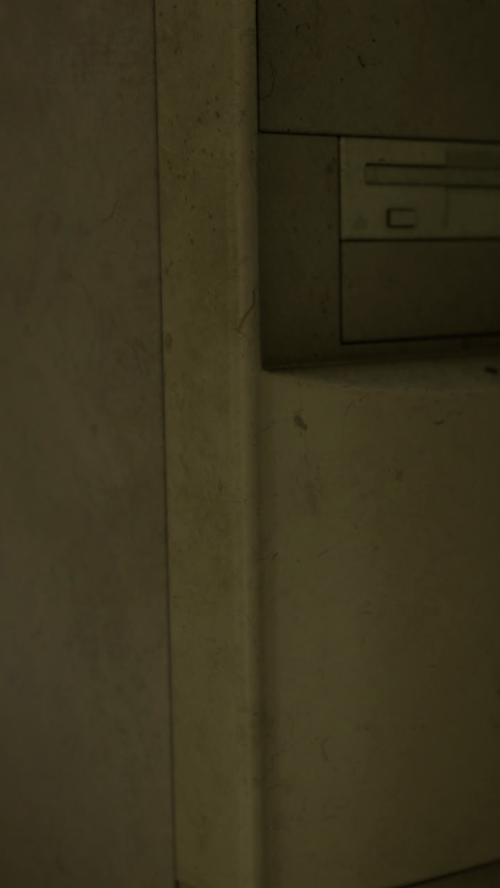 Detailed view of a computer tower from an old office setting