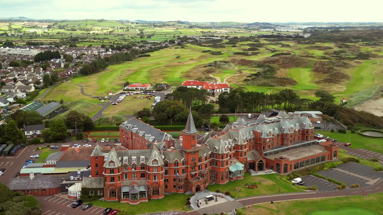 Clockwise rotating aerial video of Slieve Donard Hotel and Newcastle Beach in County Down, Northern Ireland. Filmed in 4K, 30FPS and with Rec709 color