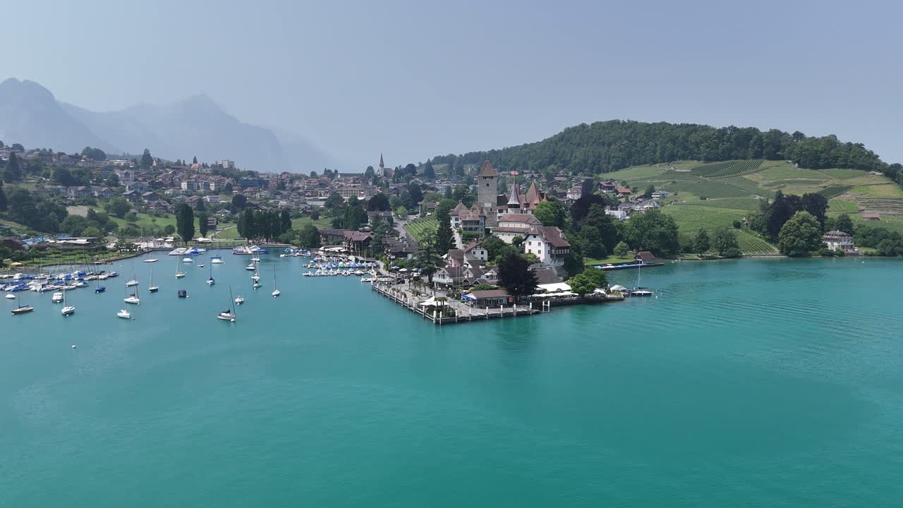Spiez Town on lake Thun Switzerland establishing aerial shot
