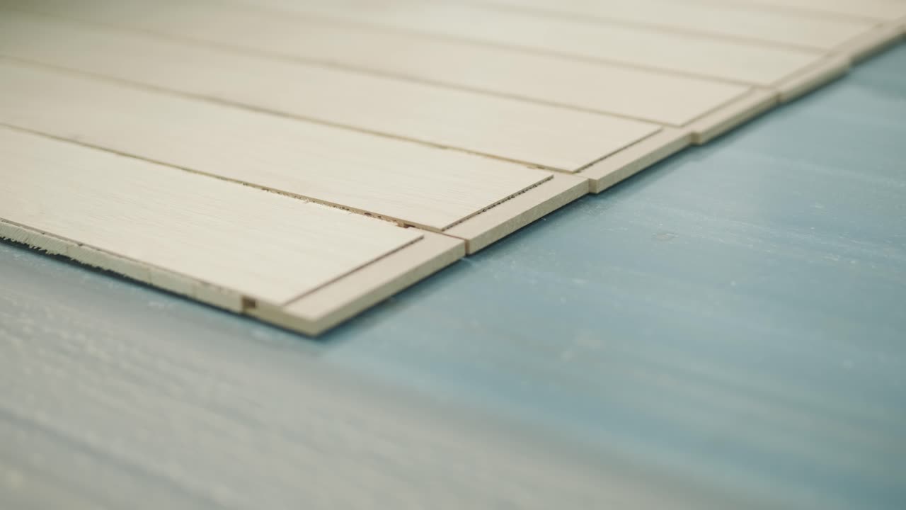 Wooden Slats Moving Along a Conveyor Belt in a Factory