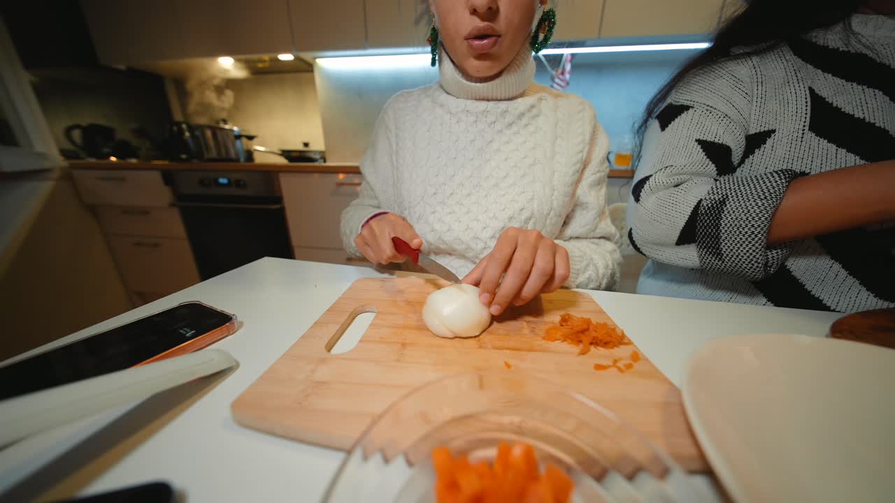 Woman cooking with an onion