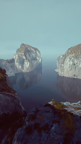 tranquil landscape with mountain range and reflective water