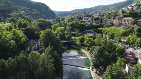 jajce riverside view with cascading falls, bosnia