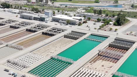 Disinfection-pre-treatment-tanks-at-Metropolitan-Water-District-of-Southern-California---pullback-aerial-reveal