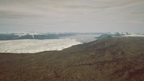 vast glacier landscape showcasing icy formations and rugged terrain in summer
