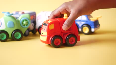 child playing with toy cars